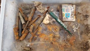 Contents of a geocache that has not been properly maintained by its owner