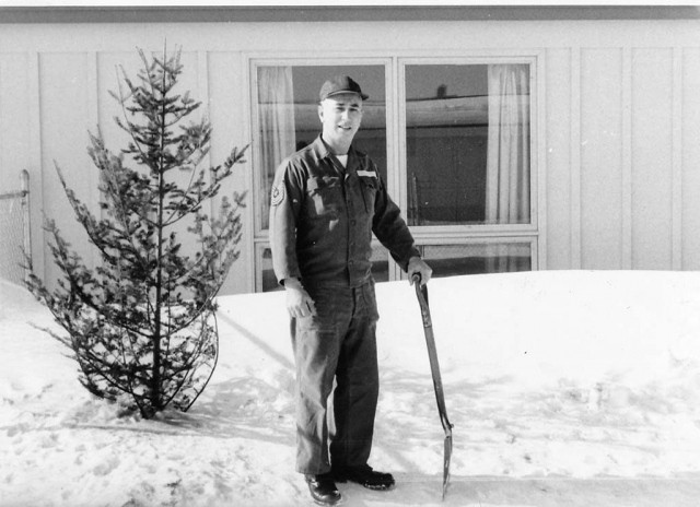 mid 1960s. Shoveling snow.  Base housing in Duluth, Minnesota.