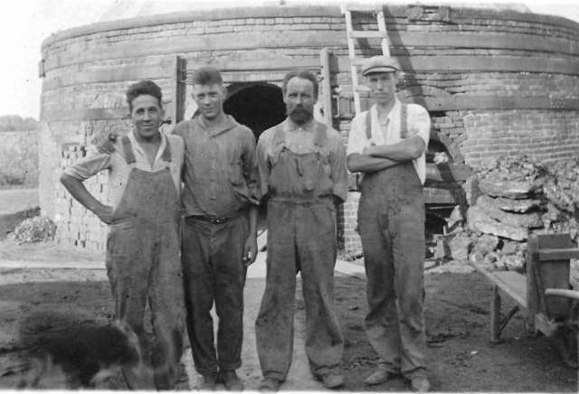 Fred Nissager, Niels Kirk, Hans Koch, Holger Koch.  Standing in front of the brick kiln at the Roxy Clay Works brickyard.  Circa late 1910s.