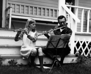 Early 1970s. Barb and Vern playing duet on flute. Luck, Wisconsin.