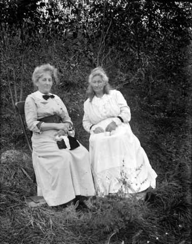 An image of Anna Nissager and Ane Koch.  Location unknown.  This was digitized from a glass negative.
