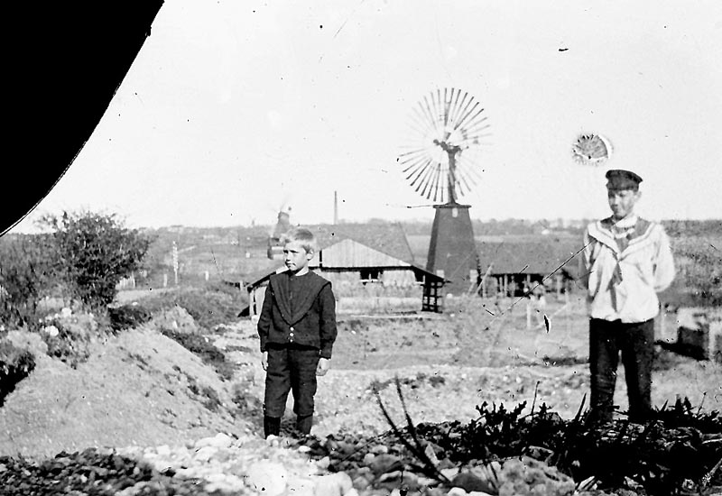 1900 "aughts". Holger and Frode Koch. Fredericia, Denmark. Their dad worked here at the "Mill Valley Tile Works". This might have been where the Koch family lived.  (You can see that the upper left corner of the glass negative broke off)