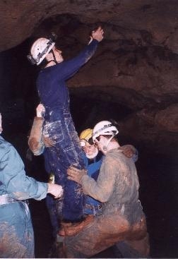 Jan 5, 2002 - Caving group at Onyx Cave. Lawrence is trying to take a close up of a bat... and needs to get REAL close.