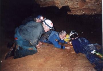 Jan 5, 2002 - Caving group at Onyx Cave. Lois, Joe, Earl Lawrence. We found the tiniest spider on the bottom of an almost invisible web. Laurence (with permits) is trying to coax the spider into a vial of alcohol.