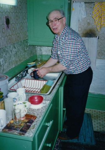 1992 - Christmas in Luck, Wisconsin.  Walt washing dishes.