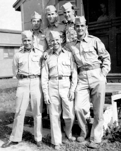 Soldiers near barracks.  Walt is top, left.