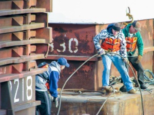Deckhands building a tow