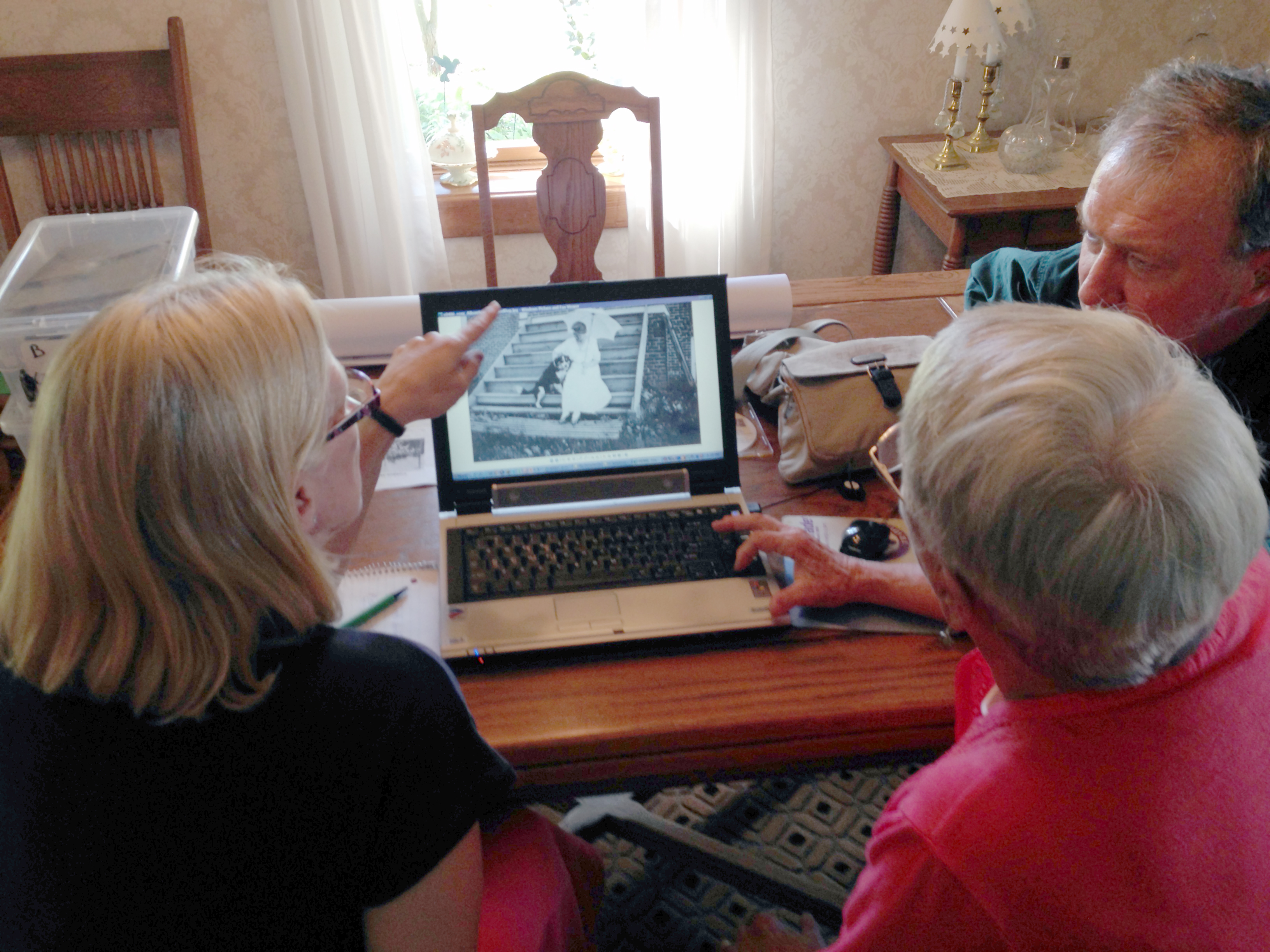 Looking at old photos from the property.  Barbara (Konopacki) Schrammen, Annette (Overgaard) Anderson, Bill Schrammen.