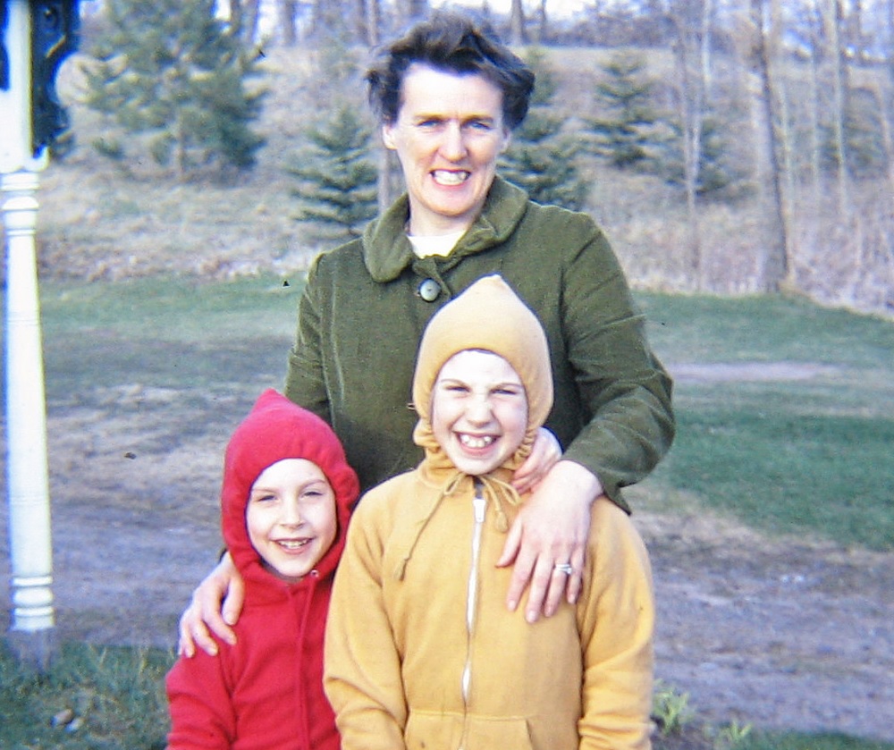 1967. Helga Konopacki with her children; Paul and Barb. Front yard of house near Luck, Wisconsin.