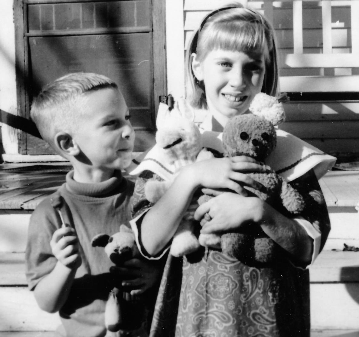 Paul with "Boy Teddy Bear", Barb with "Piglet" and "Ginger Cookie". Front yard of house near Luck, Wisconsin.