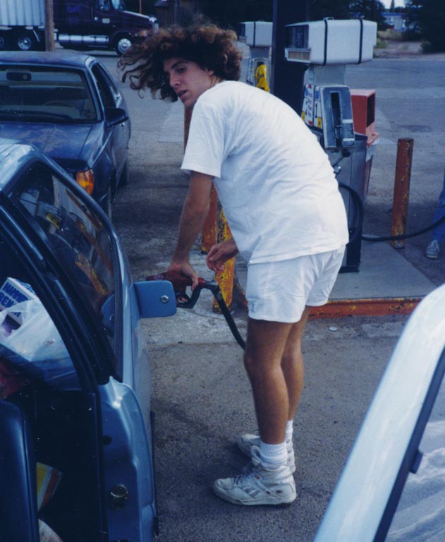 Joe putting gas in the car